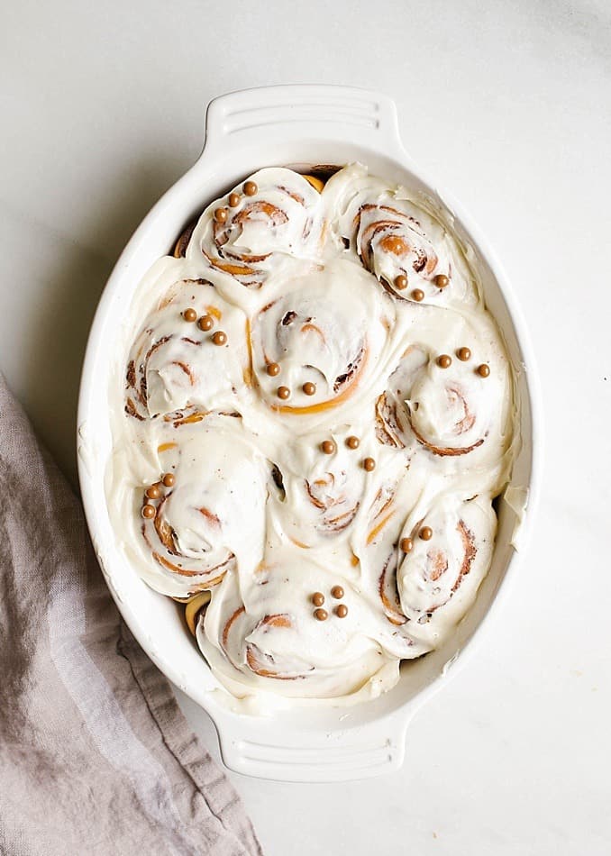 Chocolate Sweet Rolls Recipe by Kate Wood of The Wood and Spoon Blog. This recipe makes two pans of fluffy cinnamon buns filled with a chocolate and espresso swirl filling. A cream cheese glaze frosting finishes off these perfect breakfast treats. The dough is similar to a brioche style dough as it contains a bit of sugar, milk and eggs. This is a yeast roll. They make a great holiday brunch item , treat, or dessert. Find the recipe and the how to on thewoodandspoon.com