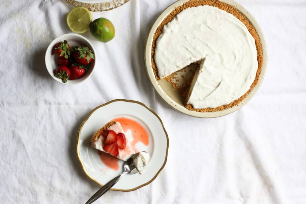 vegan coconut lime ice cream pie This is a vegan coconut ice cream recipe made in a machine with lime zest and sweetened with sugar. It's frozen inside a press-in graham cracker crust and the whole thing is topped with a strawberry lime compote. This pie is refreshing and delicious, perfect for the special diet vegan/ vegetarian friends in your life. Find the recipe for this berry lime icebox pie on thewoodandspoon.com