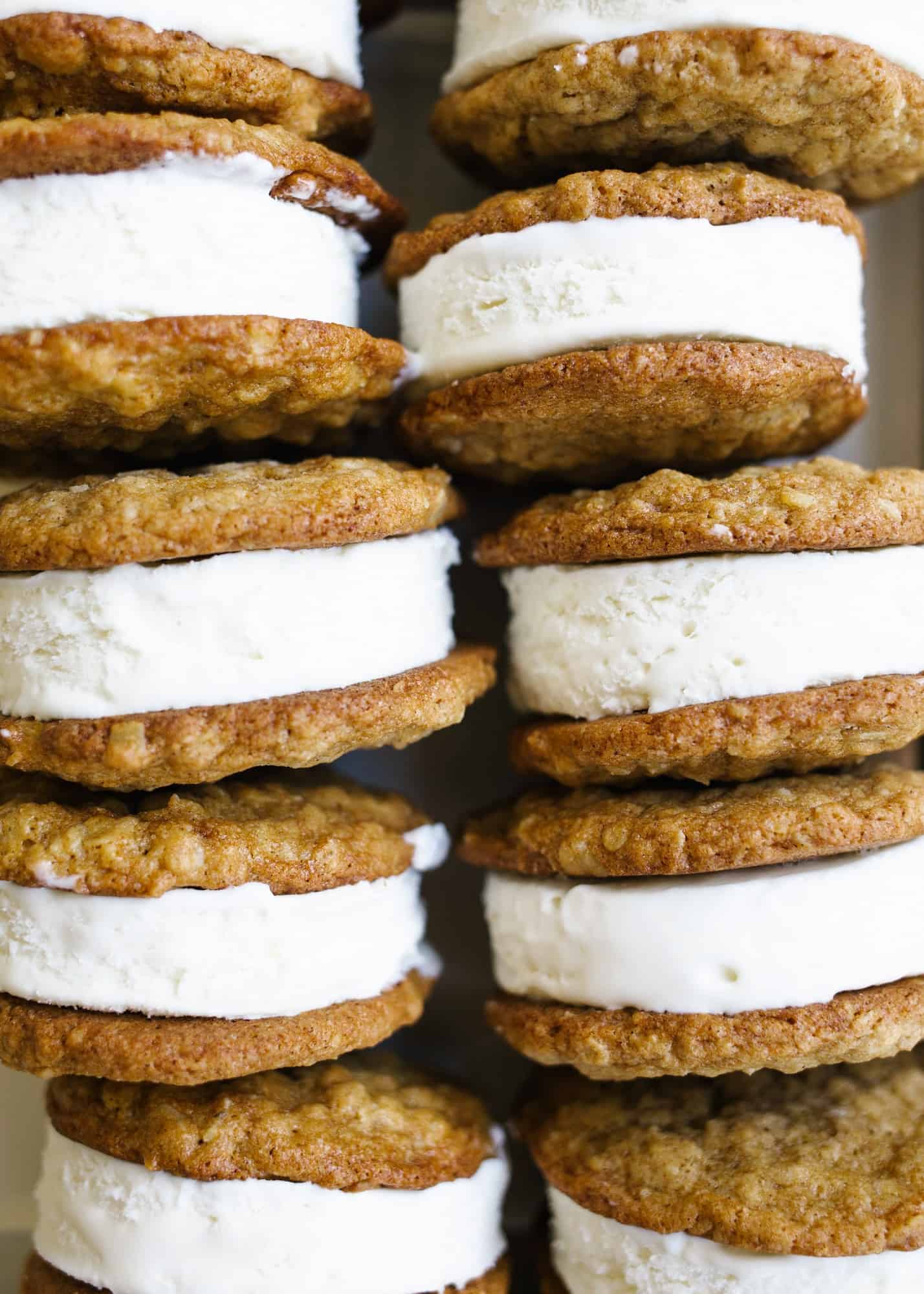 Oatmeal Cream Pie Ice Cream Sandwiches by Wood and Spoon blog. These are a frozen version of the traditional store bought cookie sandwiches made with chewy thin oatmeal cookies and filled with a no-churn marshmallow ice cream. The ice cream comes together with three ingredients including marshmallow fluff and the cookies stay soft even when frozen! Learn more about this treat and how to make homemade frozen ice cream sandwiches on thewoodandspoon.com