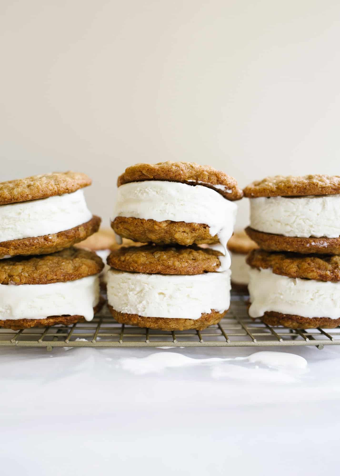 Oatmeal Cream Pie Ice Cream Sandwiches by Wood and Spoon blog. These are a frozen version of the traditional store bought cookie sandwiches made with chewy thin oatmeal cookies and filled with a no-churn marshmallow ice cream. The ice cream comes together with three ingredients including marshmallow fluff and the cookies stay soft even when frozen! Learn more about this treat and how to make homemade frozen ice cream sandwiches on thewoodandspoon.com