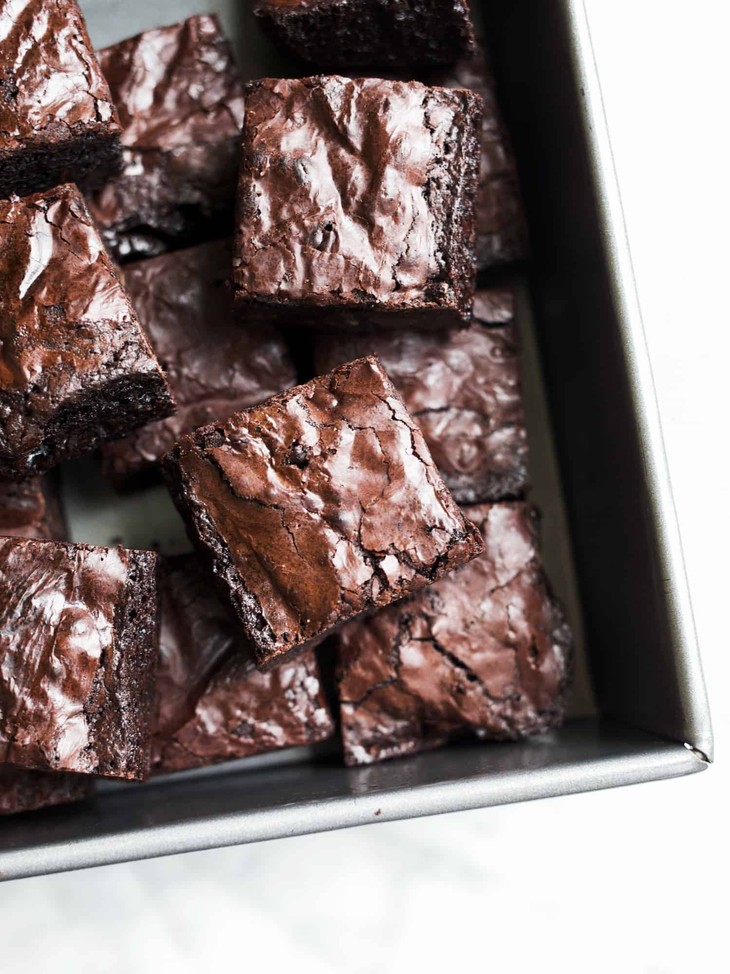 Easy Chewy Brownies by Wood and Spoon blog. This is a simple one-bowl recipe that makes a great homemade substitute for box brownie mix! These have a crackled top, fudgy insides, and loads of chocolate espresso flavor. Learn more and how easy it is on thewoodandspoon.com