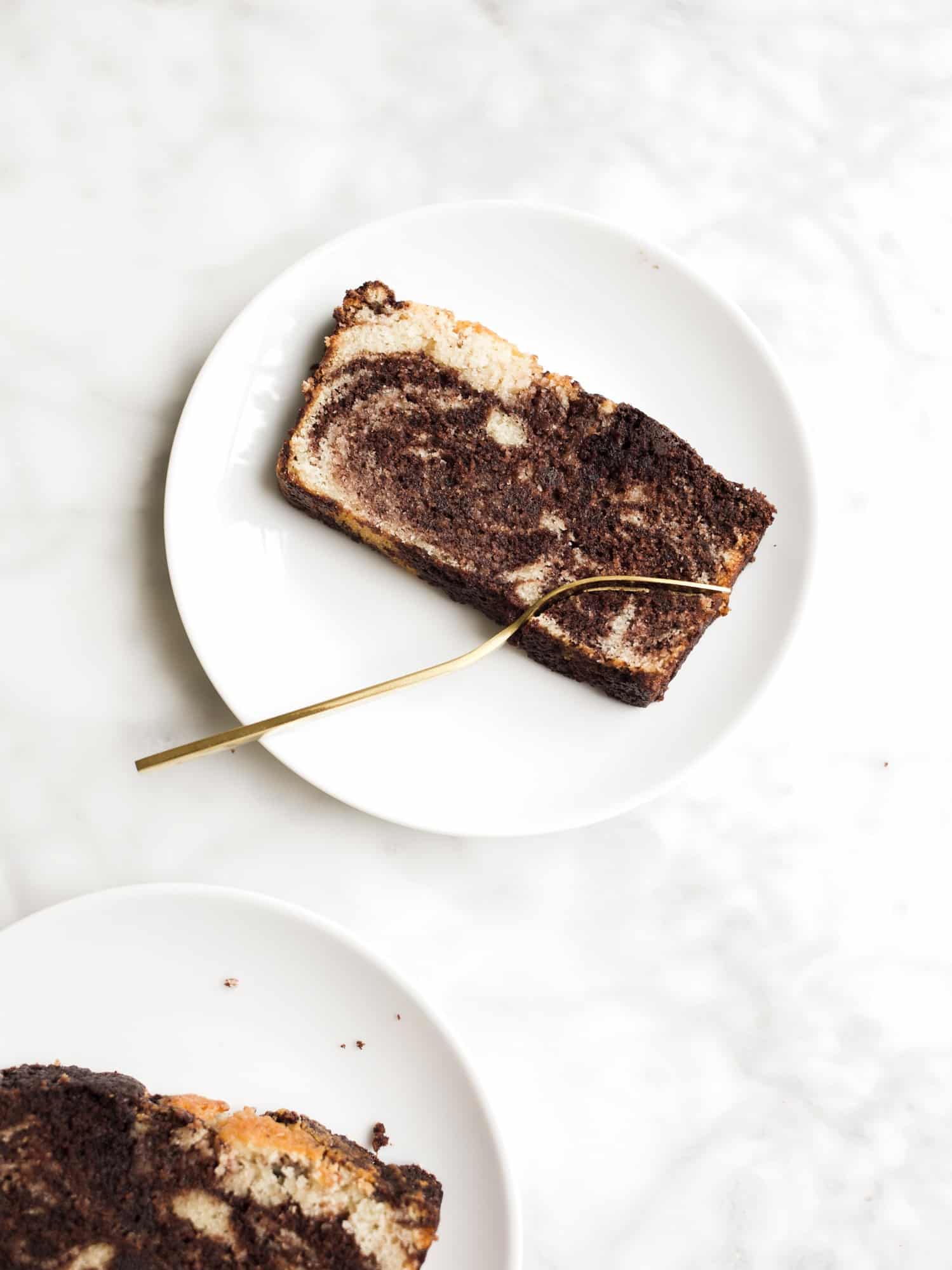 Marble Loaf Pound Cake by The Wood and Spoon blog by Kate Wood. This is a moist and rich recipe for pound cake inspired by the chocolate marble loaf cake at Starbucks! This makes one big bread loaf that is perfect for breakfast or dessert. The recipe is topped with a chocolate ganache glaze. The vanilla and chocolate batter is swirled together to give a marbled look! Find the recipe for this southern style buttermilk pound cake on thewoodandspoon.com