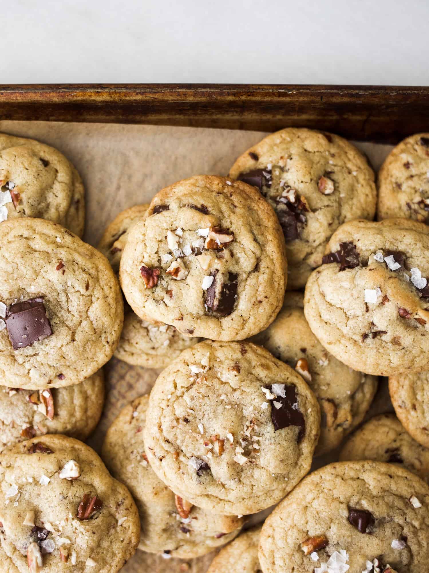 Derby Pie Cookies by Wood and Spoon Blog. These are chewy chocolate chip cookies filled with toasted pecans and bourbon whiskey. Inspired by the famous Kentucky derby dessert, these cookies take all of the favorite pie flavors and stuff them into one chewy chocolate chunk cookies. With molten centers and buttery crisp edges, these chewy treats are fun to make for a party or holiday dessert. Find the recipe on thewoodandspoon.com by Kate wood