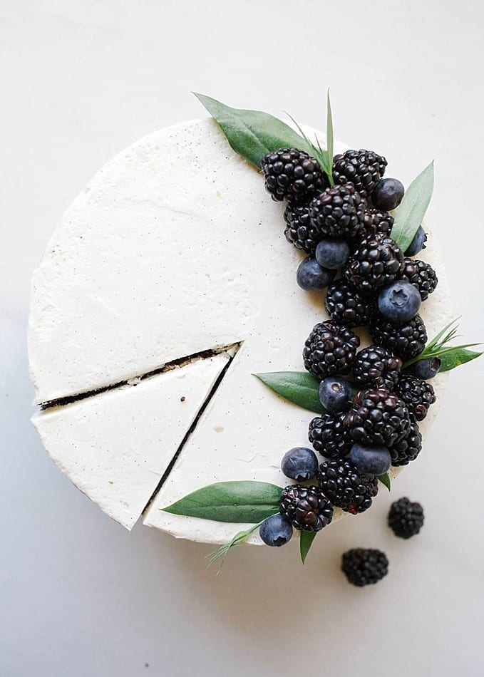 Black and White Cake By Wood and Spoon Blog by Kate Wood. This is a dark chocolate cocoa powder cake, made easily in one bowl, layered with a cooked flour vanilla bean frosting and a blackberry and dark chocolate ganache. This is a layer cake that is stunning and can even be used as a party/ wedding cake. The berry ganache is made with jam and cream. The cake is moist and fluffy, incredibly simple, and the frosting and smooth, light, and creamy cloud like. Find the recipe and the how to on thewoodandspoon.com