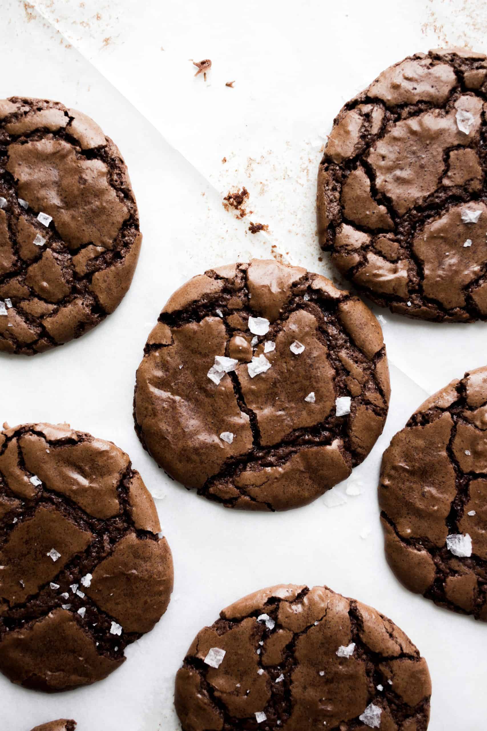 Peppermint Brownie Cookies by Wood and Spoon Blog. These are chewy crackly chocolate brownie cookies scented with mint and sprinkled with sea salt! The recipe comes from my new book, Her Daily Bread, and makes for a terrific holiday treat. Learn more about the recipe and how to make these crinkly brownie cookies on thewoodandspoon.com