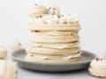 Macaron Cake by Wood and Spoon blog. Learn how to be make a beautiful French layered macaron cake using large macaron shells and buttercream frosting. These delicious treats have detailed instructions and are simple to create. Learn how on thewoodandspoon.com