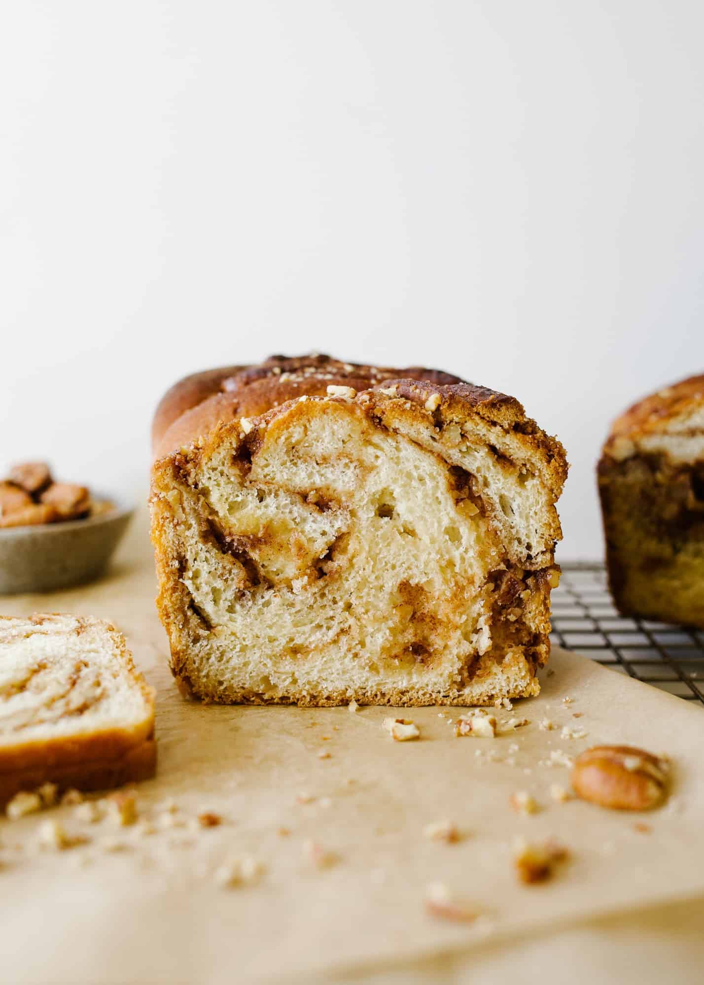 Pecan Babka by Wood and Spoon blog. This is a light and fluffy cinnamon swirl bread filled with brown sugar, cinnamon, and pecans! The loaves are tender, buttery, and lightly sweetened, and this bread makes for an excellent dessert or breakfast treat! Learn how to make it and braid your own babka on thewoodandspoon.com