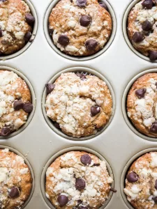 Whole Wheat Chocolate Chip Muffins by Wood and Spoon blog by Kate Wood. This quick and easy muffin recipe uses whole wheat flour, brown sugar, and semisweet chocolate chips to make a fluffy, moist muffin. each is topped with a simple streusel. For a healthy spin on a chocolate lover's breakfast favorite, try these muffins! Find the recipe on thewoodandspoon.com