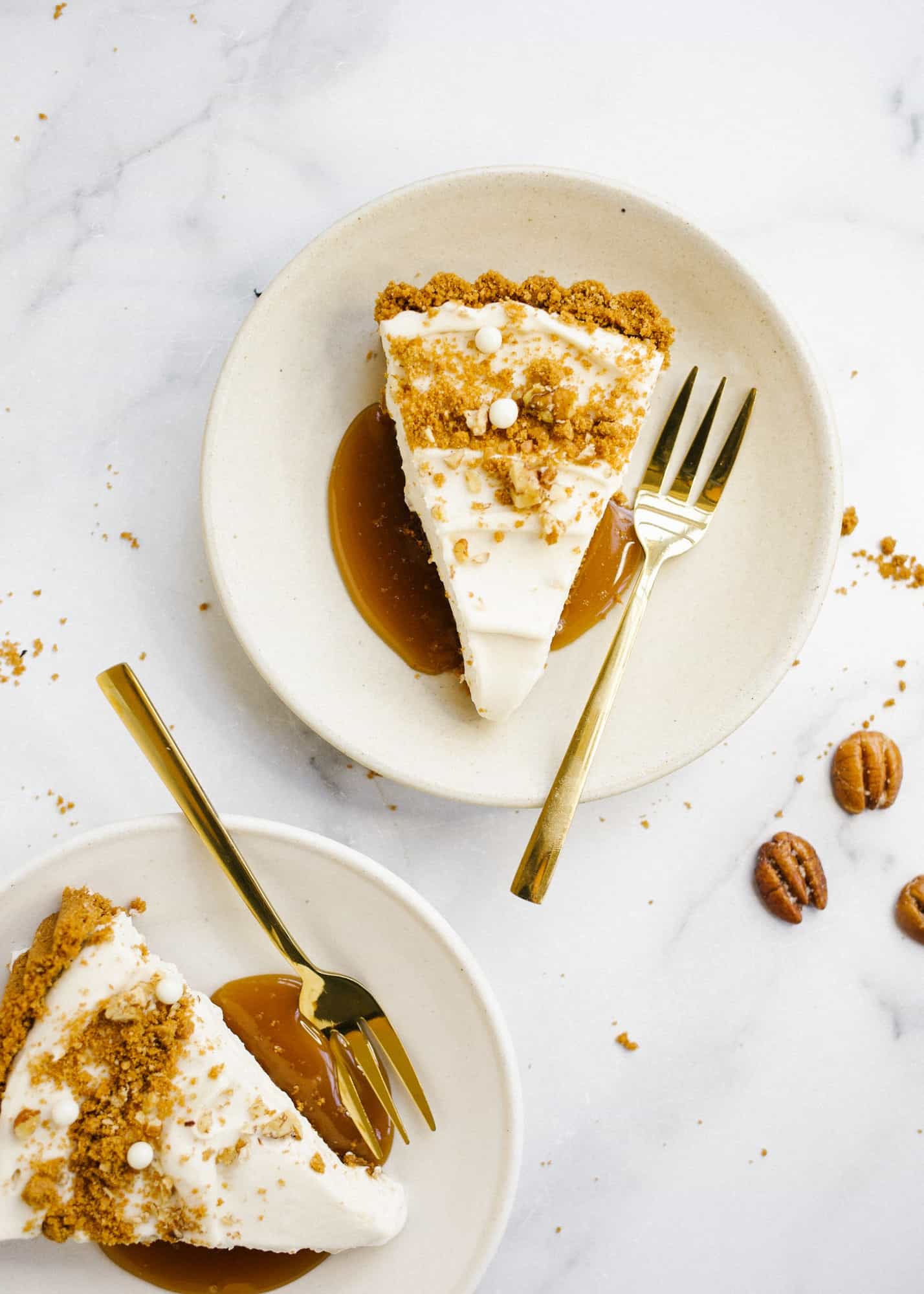 Maple Cream Tart by Wood and Spoon. This is a simple cream tart made with a biscoff cookie and pecan crust, a maple cream pie filling, and a homemade maple caramel. This sweet and salty holiday dessert can be made ahead and feeds a crowd. Learn how to make this beautiful fall dessert on thewoodandspoon.com