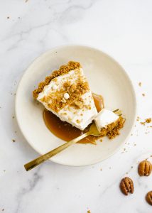 Maple Cream Tart by Wood and Spoon. This is a simple cream tart made with a biscoff cookie and pecan crust, a maple cream pie filling, and a homemade maple caramel. This sweet and salty holiday dessert can be made ahead and feeds a crowd. Learn how to make this beautiful fall dessert on thewoodandspoon.com