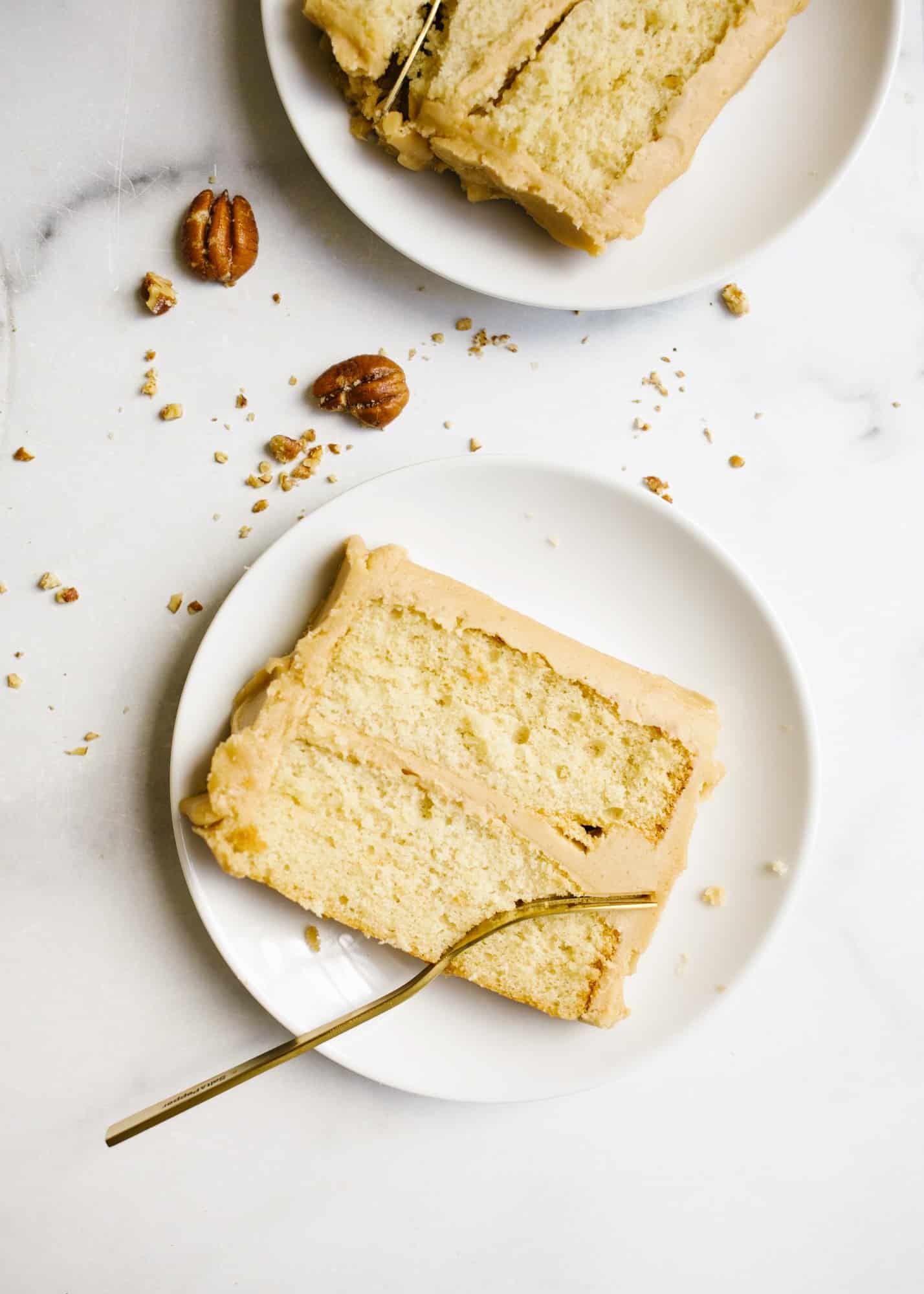 Bourbon Caramel Cake by Wood and Spoon blog. This is a fluffy brown sugar bourbon cake with a Southern old fashioned caramel frosting made with brown sugar. This is a small batch cake that only serves a few, perfect for weeknight baking. This rectangular cake makes sweet and salty layers that are perfect for fall and holiday baking. Learn how to make old fashioned icing on thewoodandspoon.com