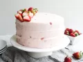 Ashley's Mac's Strawberry Cake by Wood and Spoon blog. This is the recipe for the famous strawberry layer cake from Alabama chain restaurant. The recipe comes from Ashley McMakin's new book! Learn how to make a yummy pink strawberry celebration cake on thewoodandspoon.com