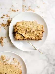 Cinnamon Streusel Bread by Wood and Spoon blog. This is a simple fluffy coffee cake loaf filled with a cinnamon brown sugar filling and topped with a crumbly streusel. The end result is a yummy quick bread that tastes great as breakfast or dessert. Learn how to make this make ahead brunch bread on thewoodandspoon.com.