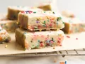 Gooey Funfetti Bars by Wood and Spoon. These are gooey blondie bars loaded with cake batter flavor and colorful sprinkles. These rich bars feed a crowd and can be made in one bowl in advance. Learn how simple these gooey sprinkle bars are on thewoodandspoon.com