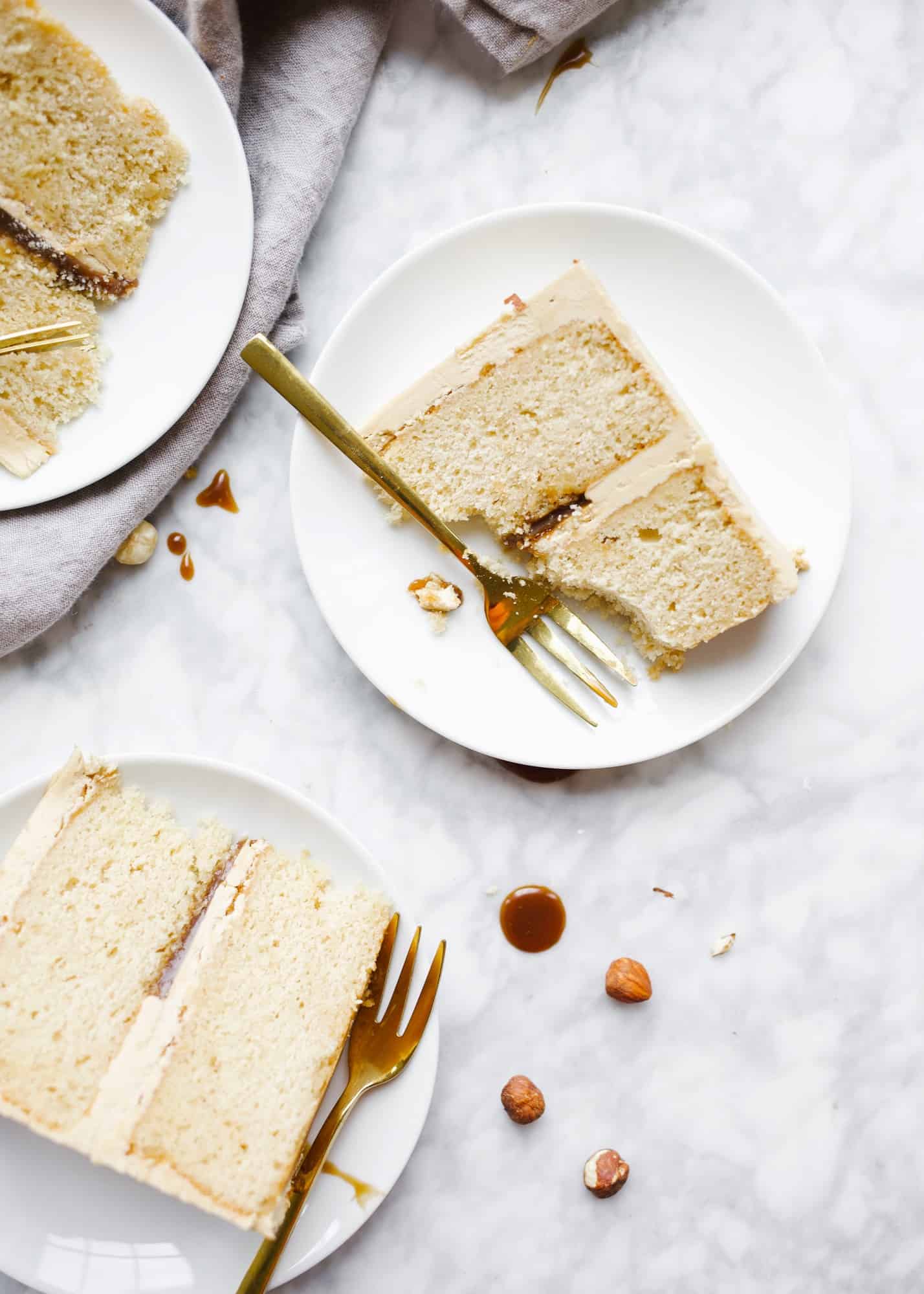 Brown Butter Balsamic Caramel Cake by Wood and Spoon blog. This is a two layer cake with fluffy brown butter layers, a balsamic vinegar scented caramel filling and a sweet and simple buttercream made with more of that same caramel. The cake is flavorful and sweet, not at all bitter, and the balsamic adds a lingering scent that is absolutely addictive. Learn how to make this sophisticated and delicious celebration cake on thewoodandspoon.com